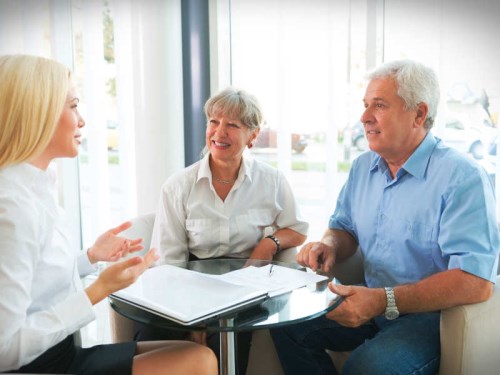 woman talking with a man and a woman